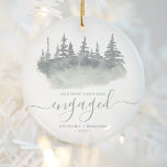 First Christmas Engaged Woodland Sage Green Script Ceramic Ornament<br><div class="desc">Commemorate your engagement with this beautiful rustic keepsake ornament. The sage green text reads "Our first Christmas engaged, " with the word "engaged" in elegant script with flourishes before and after. The watercolor illustration features a winter woodland forest scene of evergreen trees in muted shades of sage green and gray....</div>