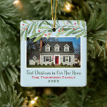 First Christmas in Our New Home Greenery Photo Ceramic Ornament<br><div class="desc">This beautiful holiday keepsake ornament features a photo of your new home with custom "First Christmas in Our New Home" script text, your family name, and the year the home was purchased. Design features modern watercolor winter greenery branches with green leaves and red berries. The light blue background color can...</div>