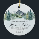First Christmas Mr and Mrs Mountains Trees Wedding Ceramic Ornament<br><div class="desc">First Christmas features a design of an elegant watercolor mountain view scenery with a modern style text layout. Design features numerous evergreen trees in various shades of greens. The back features the matching mountains and background. Mr. Mrs. is printed in a stylish script font. A perfect keepsake for newlywed couples...</div>