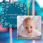 First Hanukkah Baby Stars Snowflakes Grandparents Ceramic Ornament<br><div class="desc">“First Hanukkah.” A playful visual of white Stars of David, snowflakes and handwritten script typography with customized year, overlaying the photo of your choice, help you usher in Hanukkah and New Year. On the back, additional white Stars of David, snowflakes and handwritten typography with “proud grandparents of baby’s name” overlay...</div>