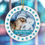 First Hanukkah Pet Kitten Photo Turquoise Paw Cute Ceramic Ornament<br><div class="desc">“My First Hanukkah.” Celebrate your new pet’s arrival this past year! A turquoise blue banner with your pet’s name and year in whimsical white typography overlays your kitten or puppy’s custom photo. A playful border of turquoise blue paw prints and Stars of David against white surrounds it. Feel the warmth...</div>