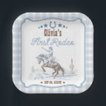 First Rodeo 1st Birthday Blue Western Paper Plates<br><div class="desc">Cherish your little cowboy's first-year milestones with our beautifully designed 'My First Rodeo' suite. The design features a retro vintage cowboy illustration set against a picturesque desert landscape with cacti, all highlighted by a blue plaid pattern. CUSTOMIZATION: If you need design customization, please get in touch with me via chat....</div>