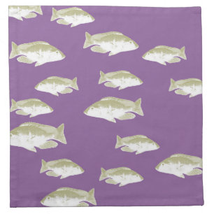 Fish on purple cloth napkin