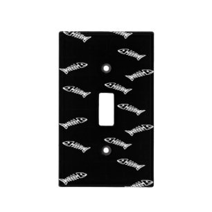 Fish skeleton on black light switch cover