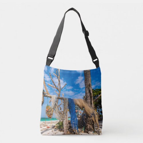 Fishing nets drying on the beach crossbody bag