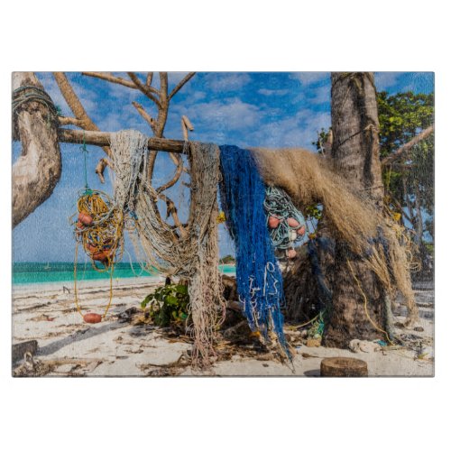 Fishing nets drying on the beach cutting board