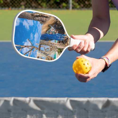 Fishing nets drying on the beach pickleball paddle