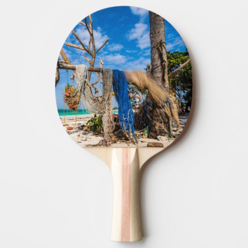 Fishing nets drying on the beach ping pong paddle