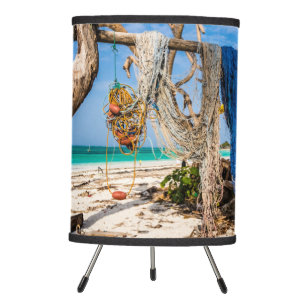 Fishing nets drying on the beach tripod lamp