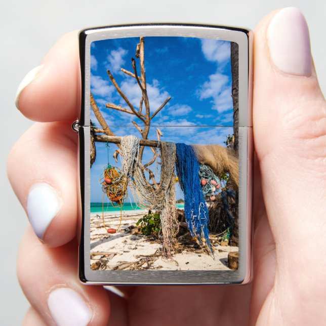Fishing nets drying on the beach Zippo Lighter (In Hand)