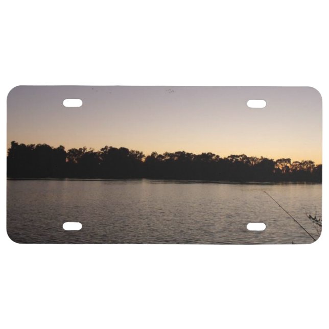 Fishing poles silhouette against the sun set license plate (Front)