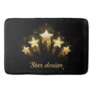 Five gold stars on black bath mat