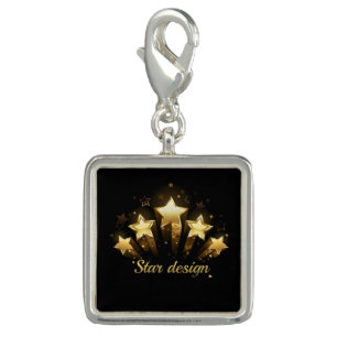 Five gold stars on black charm