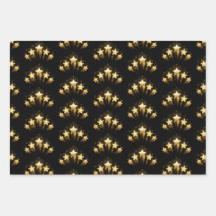 Five gold stars on black wrapping paper sheets