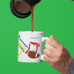 Flag Football Coach Player Personalized Coffee Mug<br><div class="desc">Create a personalized gift that's perfect for flag football players and flag football coaches. This mug features illustrations of footballs and a colorful assortment of flag belts. It's ready to be personalized with a name in blue lettering. The name appears on both sides of the mug. The graphics wrap around...</div>