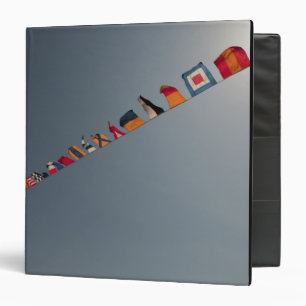 Flags fly over the deck of the USS Iwo Jima Binder