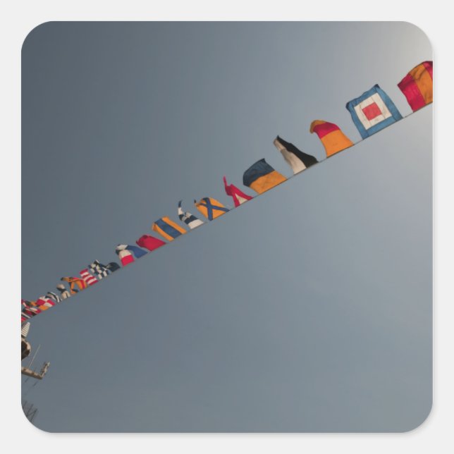 Flags fly over the deck of the USS Iwo Jima Square Sticker (Front)