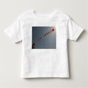 Flags fly over the deck of the USS Iwo Jima Toddler T-shirt