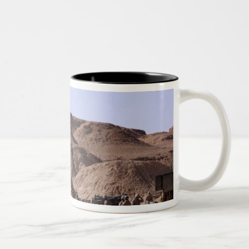 Flame and smoke emerge from the muzzle Two_Tone coffee mug