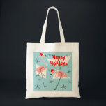 Flamingo Santas Blue Happy Holidays tote bag<br><div class="desc">A lively,  quirky Christmas design with retro touch featuring pink flamingos wearing Santa hats,  cream geometric shapes,  and stars on a blue (colour change) background.  A customizable design for you to personalise with your own text,  images and ideas. An original digital art image created by QuirkyChic.</div>