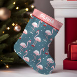 Flamingo Tropical Christmas Small Christmas Stocking<br><div class="desc">Bring a touch of paradise to your Christmas with this festive personalized stocking. A vibrant flamingo adorned with Santa hat and holiday lights against a lush tropical backdrop sets the scene for a fun and unique celebration. Perfect for beach lovers and those dreaming of a warm holiday escape, this stocking...</div>