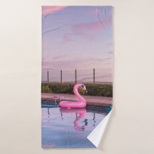 Flamingo water floater in swimming pool bath towel