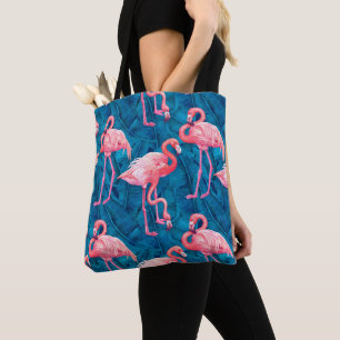 Flamingos on blue banana leaves tote bag