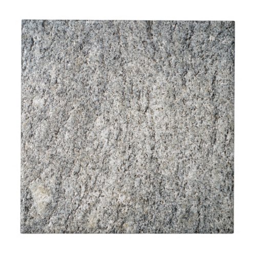 Flat surface of a gray granite stone tile