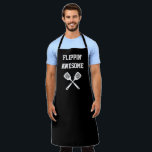 Flippin Awesome Spatula Funny Black Grilling Apron<br><div class="desc">The perfect apron for the chef whose spatula skills are beyond compare, whether flipping burgers on the grill or pancakes on the griddle. Two crossed spatulas appear silhouetted in white under the words "Flippin' Awesome" in white capital letters on a black background. The perfect way to show your appreciation for...</div>