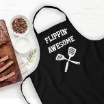 Flippin Awesome Spatula Funny Black Grilling Apron<br><div class="desc">The perfect apron for the chef whose spatula skills are beyond compare, whether flipping burgers on the grill or pancakes on the griddle. Two crossed spatulas appear silhouetted in white under the words "Flippin' Awesome" in white capital letters on a black background. The perfect way to show your appreciation for...</div>