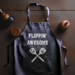 Flippin Awesome Spatula Funny Navy Blue Grilling Apron<br><div class="desc">As seen on the Today Show! The perfect apron for the chef whose spatula skills are beyond compare, whether flipping burgers on the grill or pancakes on the griddle. Two crossed spatulas appear silhouetted in white under the words "Flippin' Awesome" in white capital letters on a navy blue background. The...</div>