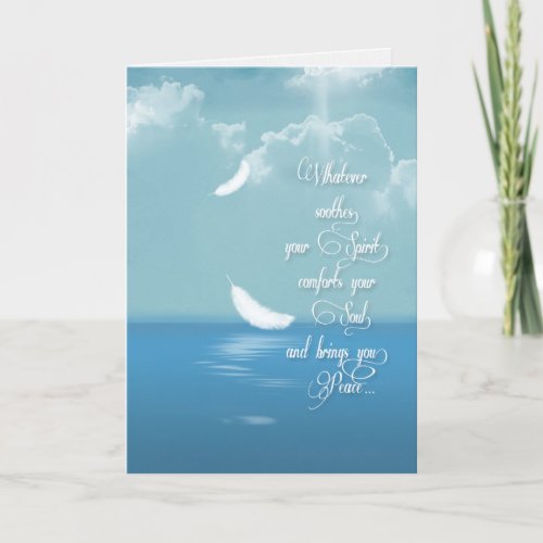 floating feathers over ocean for sympathy card