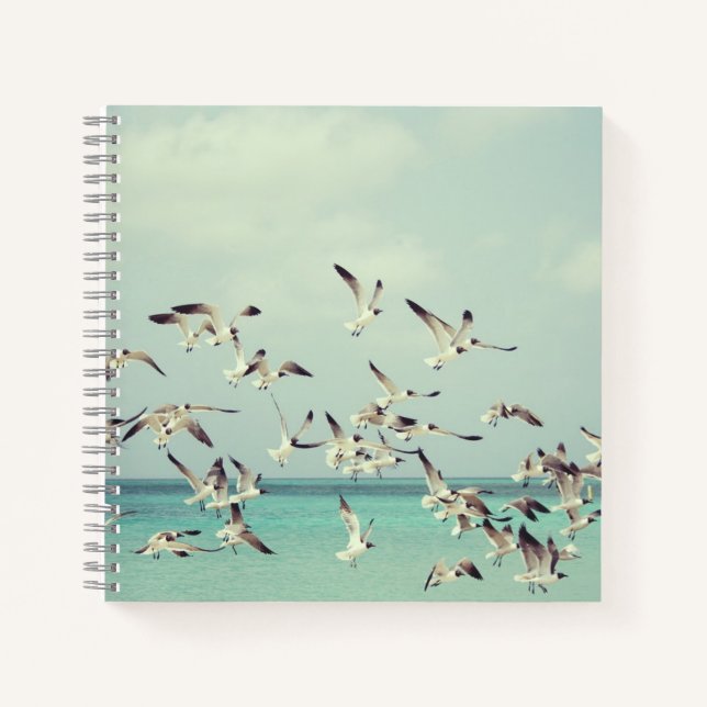 Flock of Flying Seagulls Over Ocean Notebook (Front)