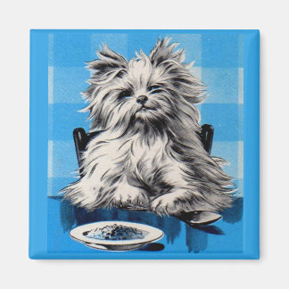 floofy dog eating at the table magnet