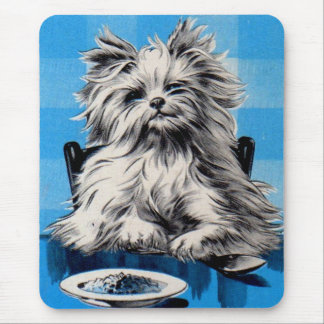 floofy dog eating at the table mouse pad