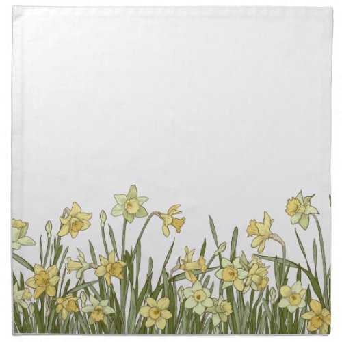 Floral border of yellow daffodils on a cloth napkin