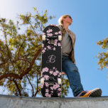 Floral Cherry Blossom Monogram Black Pink Skateboard<br><div class="desc">Pink black botanical cherry blossom design for teen girls.
Customize this Skateboard with your daughter´s monogram!</div>