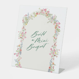 floral green arch build a bouquet wedding pedestal sign