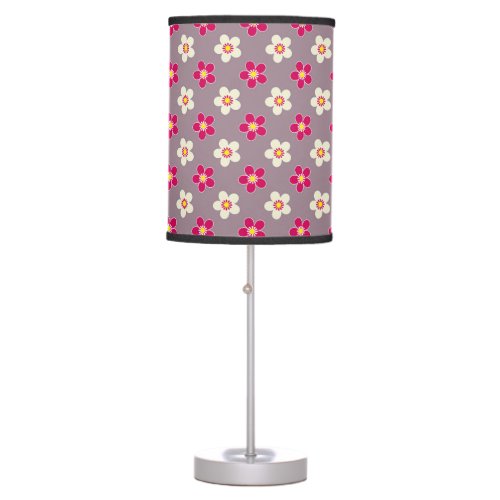 Floral pattern of crimson and white flowers on a c table lamp