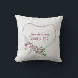 Floral Ribbon Heart with Wedding Date Throw Pillow<br><div class="desc">Pink flowers with green ivy bouquet on white satin ribbon heart on off white speckled background.
Names and wedding date are editable.
Can be used for anniversary or wedding gift.</div>