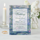 Floral Water Lilies Monet Painting Elegant Wedding Invitation<br><div class="desc">This botanical invitation has as a background a water lilies painting  by Claude Monet (now in the public domain).. The text is in a transparent white rectangle.. The occasion "Wedding" and the names are  written in a blue elegant calligraphic script,  the rest in small black caps.</div>