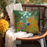 Flower Garden | Gustav Klimt Throw Pillow<br><div class="desc">Flower Garden (1905-1907) by Austrian artist Gustav Klimt is a vibrant masterpiece of early 20th-century art. This lush, impressionistic scene bursts with colorful blossoms in a mesmerizing tapestry of nature, reflecting Klimt’s decorative style and love for floral motifs. The painting’s rich textures and intricate details make it a timeless choice...</div>