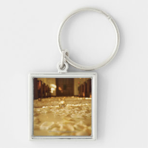 Flower petals on floor of church keychain