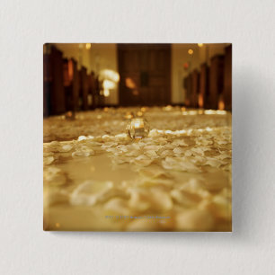 Flower petals on floor of church pinback button