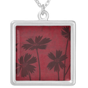 Flowerhead Silhouettes on Crimson Background Silver Plated Necklace