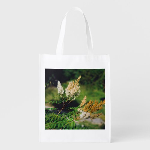 Fluffy branch with flowers in a forest grocery bag