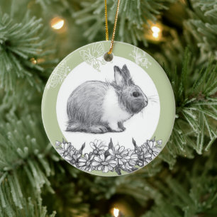 Fluffy hare with butterflies on green background ceramic ornament