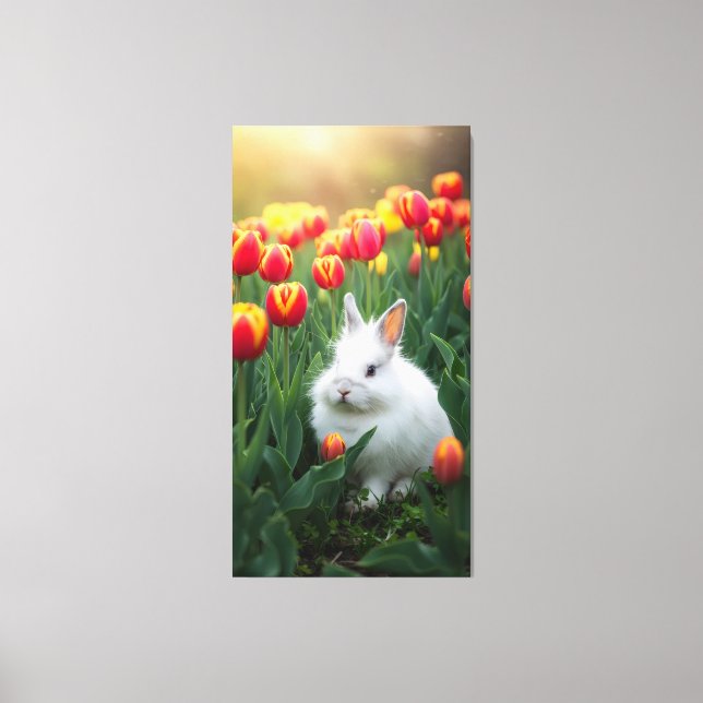 fluffy white rabbit sits among the tulips  canvas print (Front)