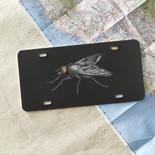 Fly Buddy giant fly black plastic license plate (In Situ)