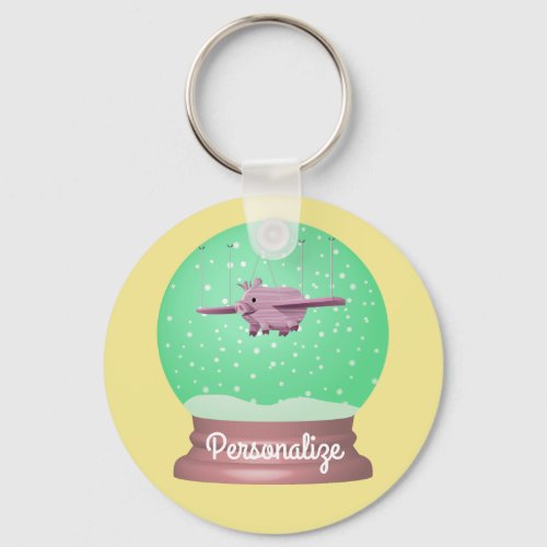 Flying pig snow globe keychain